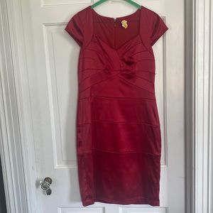 Red sweetheart neckline with cap sleeves.